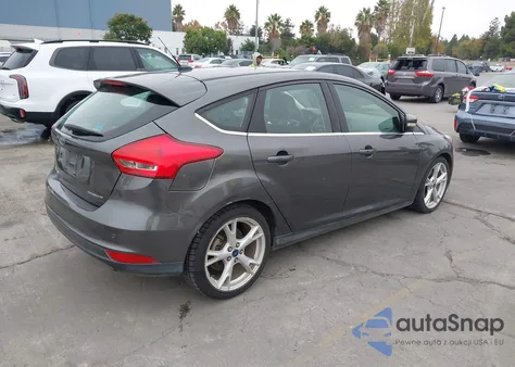 2015 Ford Focus Titanium z USA, uszkodzony, nr VIN 1FADP3N24FL386265